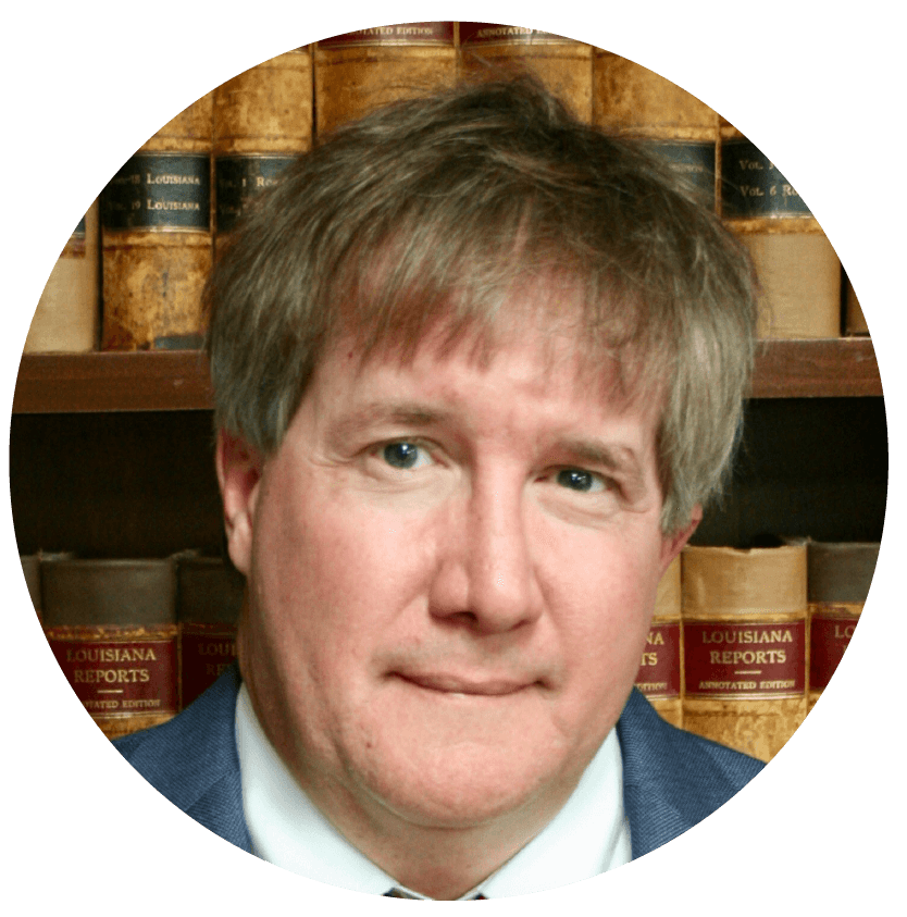 A Portrait Image of a Lawyer Behind Law Books